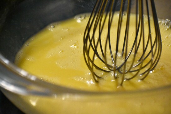 Whisk together eggs and milk.