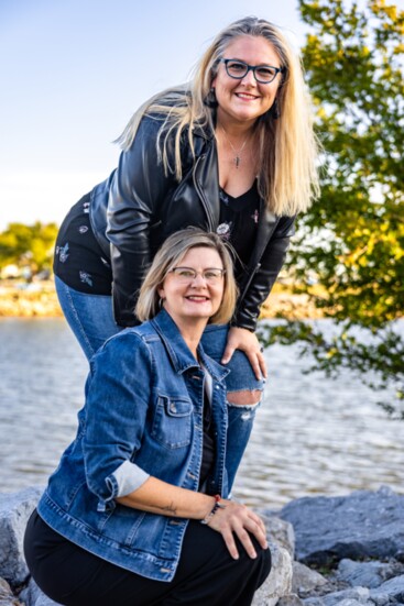 Sea Gypsy Travel owner Jamie Conover in denim jacket) and colleague Brandi  Gibson