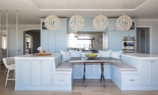 Sarah Weiland custom designed this kitchen island with eat-in kitchen table so that the water views could be seen in any seat.