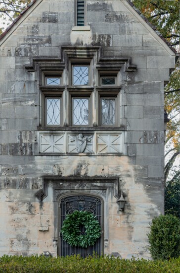 Adorned with a eucalyptus wreath, one of Kevin’s favorite architectural elements of his home is the limestone façade with its many details of the past.