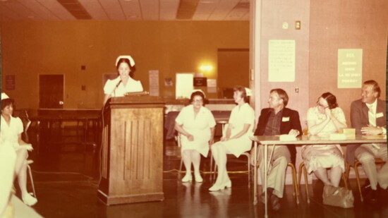 Yvonne (left, seated) during her graduation as a Registered Dental Assistant
