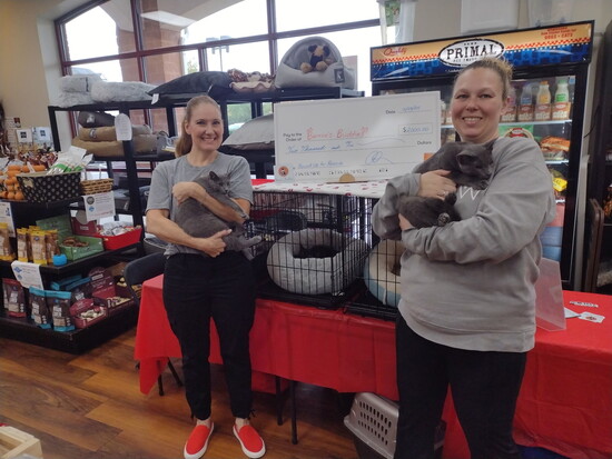 Bernie's Buddies Cat Rescue founder and president Edie Hogan, left with volunteer Chrissi Daniel at an adoption event at Barkley's Marketplace in Branchburg