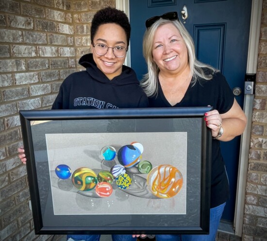 Rachel Hawkins poses with Wendy Navarro, who purchased some of her art work that was displayed at the Governor's School.
