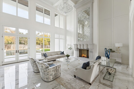 A welcoming open living room with serene views of the backyard.