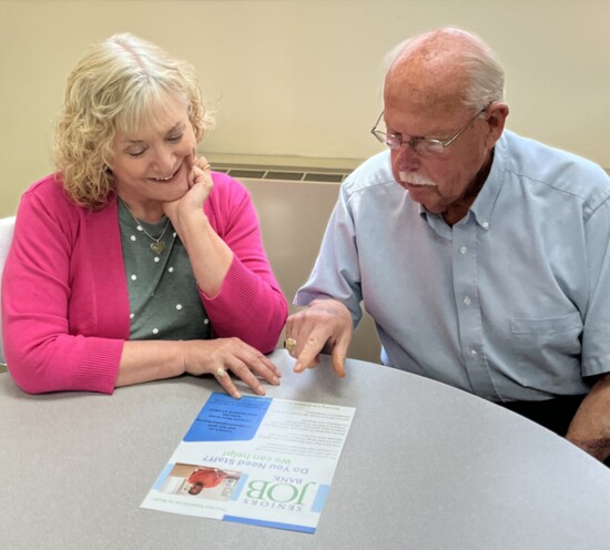 Robin Clare, Executive Director of the Seniors Job Bank, meets with a board member.