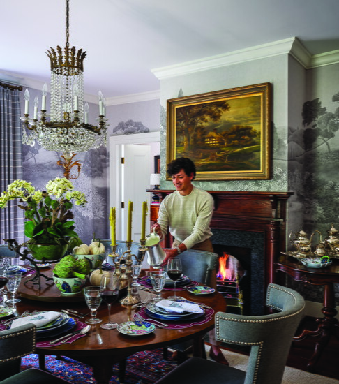 In the dining room, the custom-made table, which was in Tom’s grandparents’ breakfast room, features a built-in lazy Susan. The oil painting, also from Tom’s 