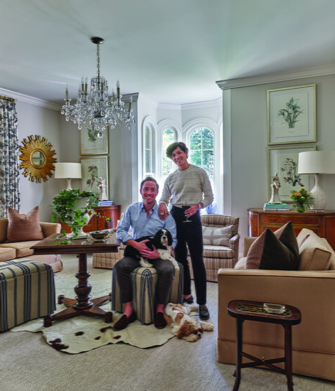 Tom and Felipe relax with their Cavalier King Charles Spaniels in their living room, a favorite gathering place for coffee, cocktails, charcuterie, or card 