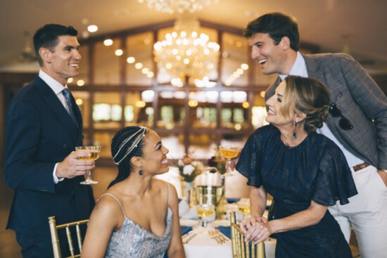 Chris Maduri and Zach Nagle, wearing designs from Daswani Clothiers, with Claudia Chong and Karin Bent, wearing dresses from The RiverLane