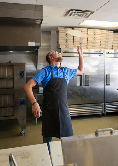 Hand-tossed pizza dough, baked fresh daily. Every pie starts right here in Roma’s kitchen.