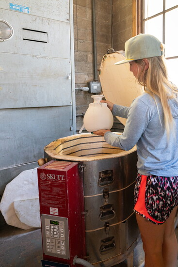 Three kilns offer ample space and opportunities for Mud Lake members like Lexy Sinnott to fire pieces of pottery. 