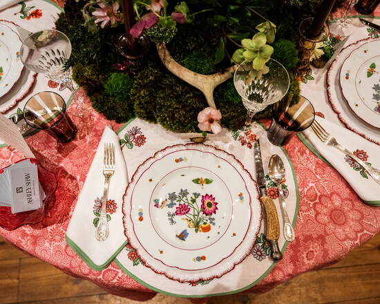 Table design by Ashley Shaw. Table linens by Loretta Caponi. Shaw sourced the chargers from a trip to Italy and incorporated vintage plates. Floral design