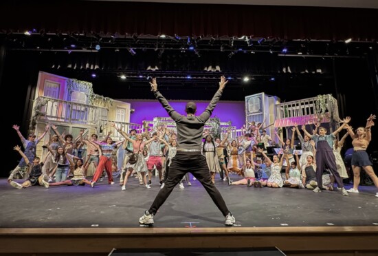 Director Coy Branscum warming up the 2023 cast of Mama Mia. Photo by: Darcy McGillicuddy