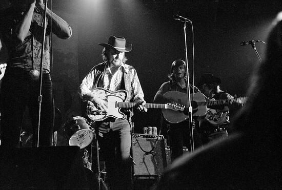 Waylon Jennings performing at Armadillo World Headquarters in the 1970s. Photograph provided by Austin Museum of Pop Culture.