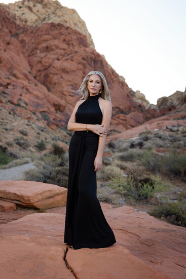 Paige Candee, styled by Marciano, stands amid the dramatic red rocks of Red Rock Canyon.