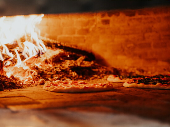 Fill your belly with a delicious slice of wood-fired pizza.