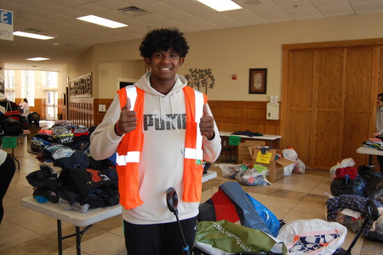 Volunteers, including from the Young Men's Service League, help bring clothes and coats  to those who need them. Photo: Dulles South Neighborhood Closet
