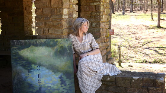 Rebekah Sanders as Georgia O'Keefe wearing Purotatto Pinstriped Flared Dress, W.KLEINBERG Matte Alligator Belt with Covered Buckle- Carriage House