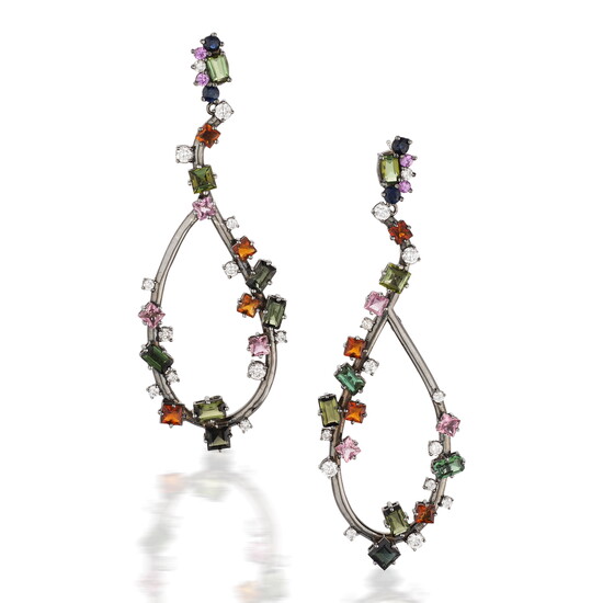 Actress Brigid Coulter wearing earrings with husband, Don Cheadle
