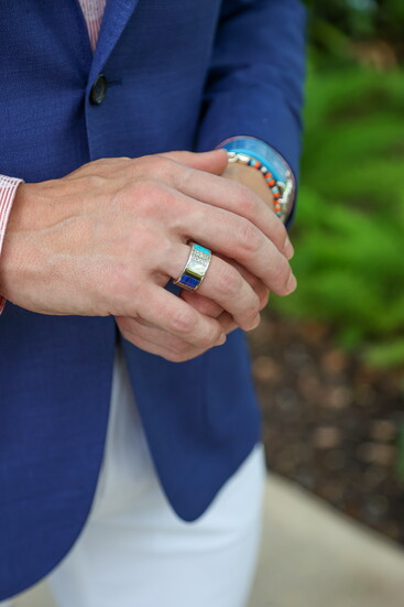 Model John Strand in Statement Jewelers' John Hardy Carved Chain Ring