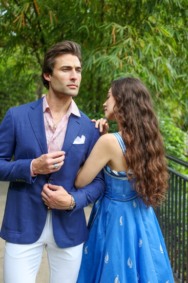 Model John Strand in John Craig Clothier's Canali Kei Jacket, Etro Shirt, Peter Millar Pant, and Sheridan Pocket Square