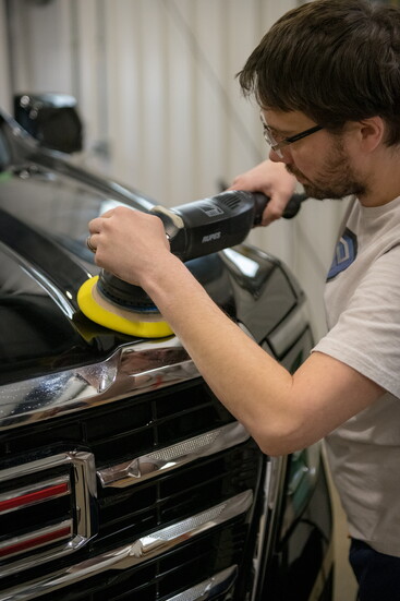 Kyle carefully buffs the vehicle’s exterior, enhancing the finish through the same attention to detail that defines Show Shine’s service.