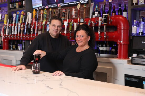 Tony and Maria Prifitera behind the bar at their Sicily Coal Fired Pizza restaurant. 