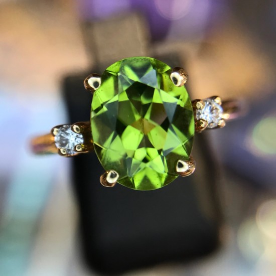 14K peridot ring with diamond accents.
