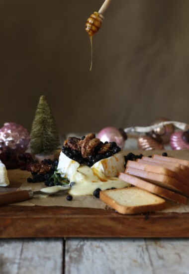 This double creme brie with truffles from Trader Joe’s can be dressed up with berries, candied pecans and a drizzle. 