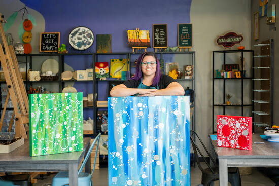 Owner Brandy Prettyman with three pieces from her 'Soda Series'
