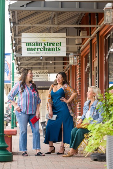 Models Jovan Young, Evelina Diaz, and Alison Krueger stepping out in style with fashions from Main Street Merchants. 