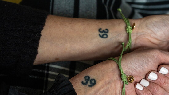The sisters memorialize "39 Wilmont" with matching tattoos