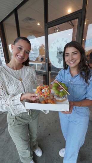 Julia, left, and Madison Shapiro share some donuts.