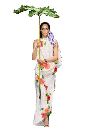Blooms Flower brooches and adornments added to blazers, coats and dresses are blossoming everywhere. Photo courtesy of WWD/Getty Images