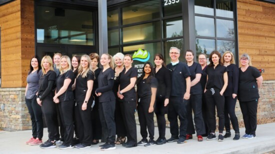 The staff at Peters Dermatology Center, Dr. Gerald Peters fifth from right. 
