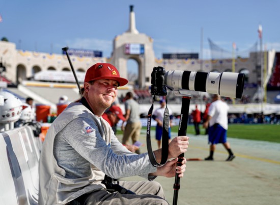 Gene Lower, ready to photograph a game
