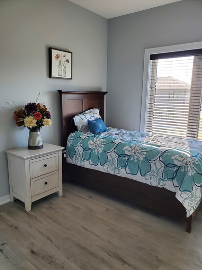 A bedroom within Garden View Manor
