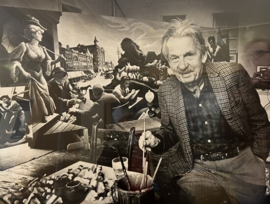 A display of materials and information used in the creation of Joplin’s mural includes this photo of the artist, Thomas Hart Benton, with the work in progress.