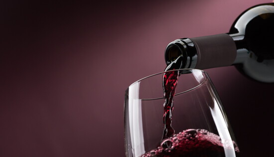Red wine being poured.