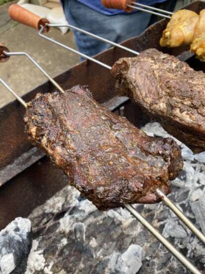 Pictured are jerk pork and chicken, signature favorites showcasing global barbecue and Chef Drew's Jamaican roots.