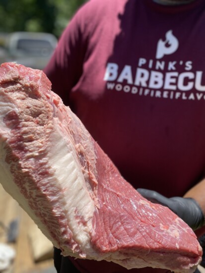 Pink's Barbecue has grown into a diverse brand founded in wood, fire, and flavor.