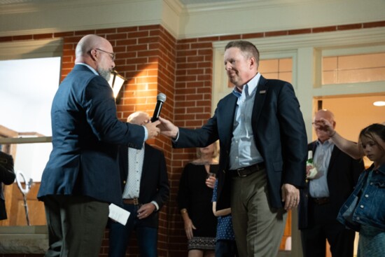 Publisher Burke Scott and Mayor Derek Norton