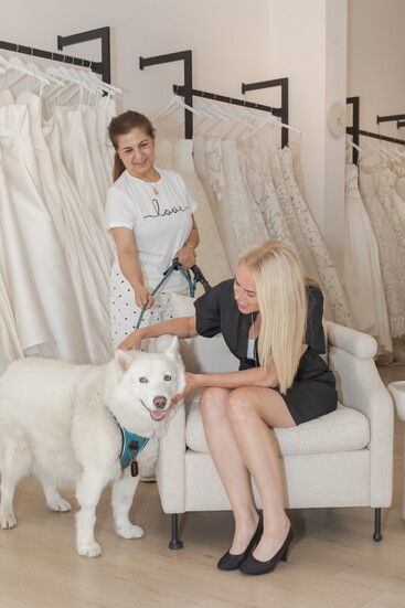 Williamson with her dog, Cody, and tailor Nano Ohansian 