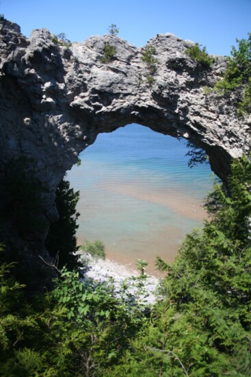 Arch Rock, a landmark on the east side of the island, rises 146 feet above the water.