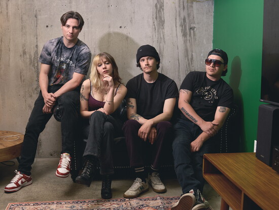 Votary poses for a portrait before playing a show at Lo-Bar Social, By Willis Bretz