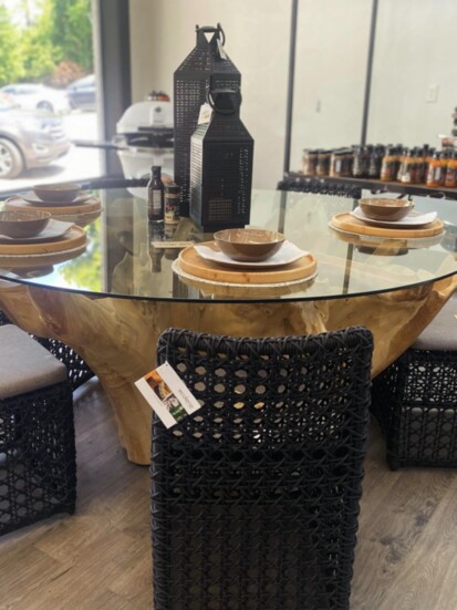 A beautiful glass-top table with a wooden base