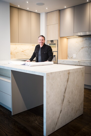 Keith stands in the kitchen of his recent project. 