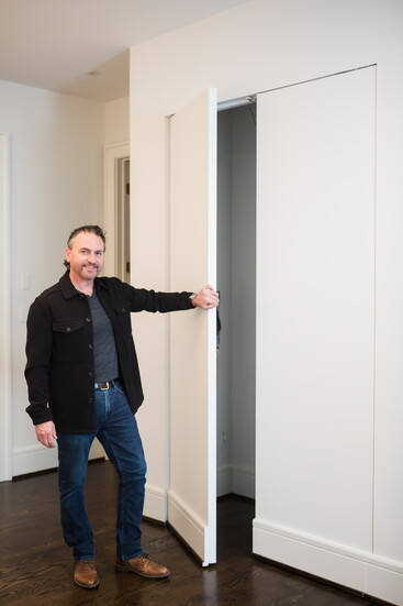 Keith says the doors of this closet are custom built and eight feet tall and five feet wide.