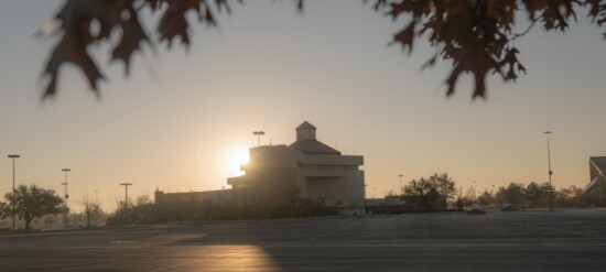 The sun rises behind the Keith Leftwich Memorial Library on the Oklahoma City Community College campus. (Photography Robert Lane)