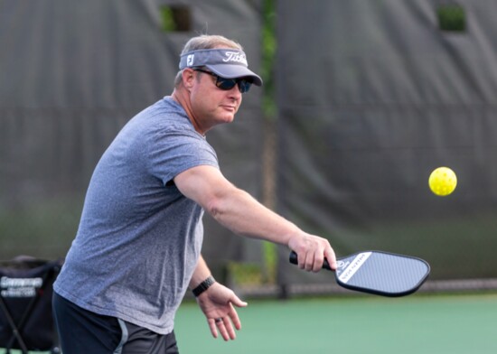 Chad Richards plays the pickleball with his backhand.
