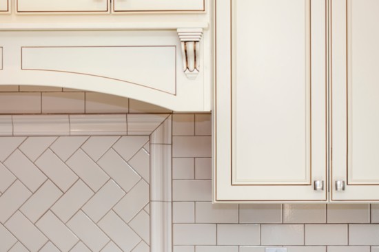 Tile backsplash: Mix equal parts water and vinegar in a spray bottle; spray and wipe.
